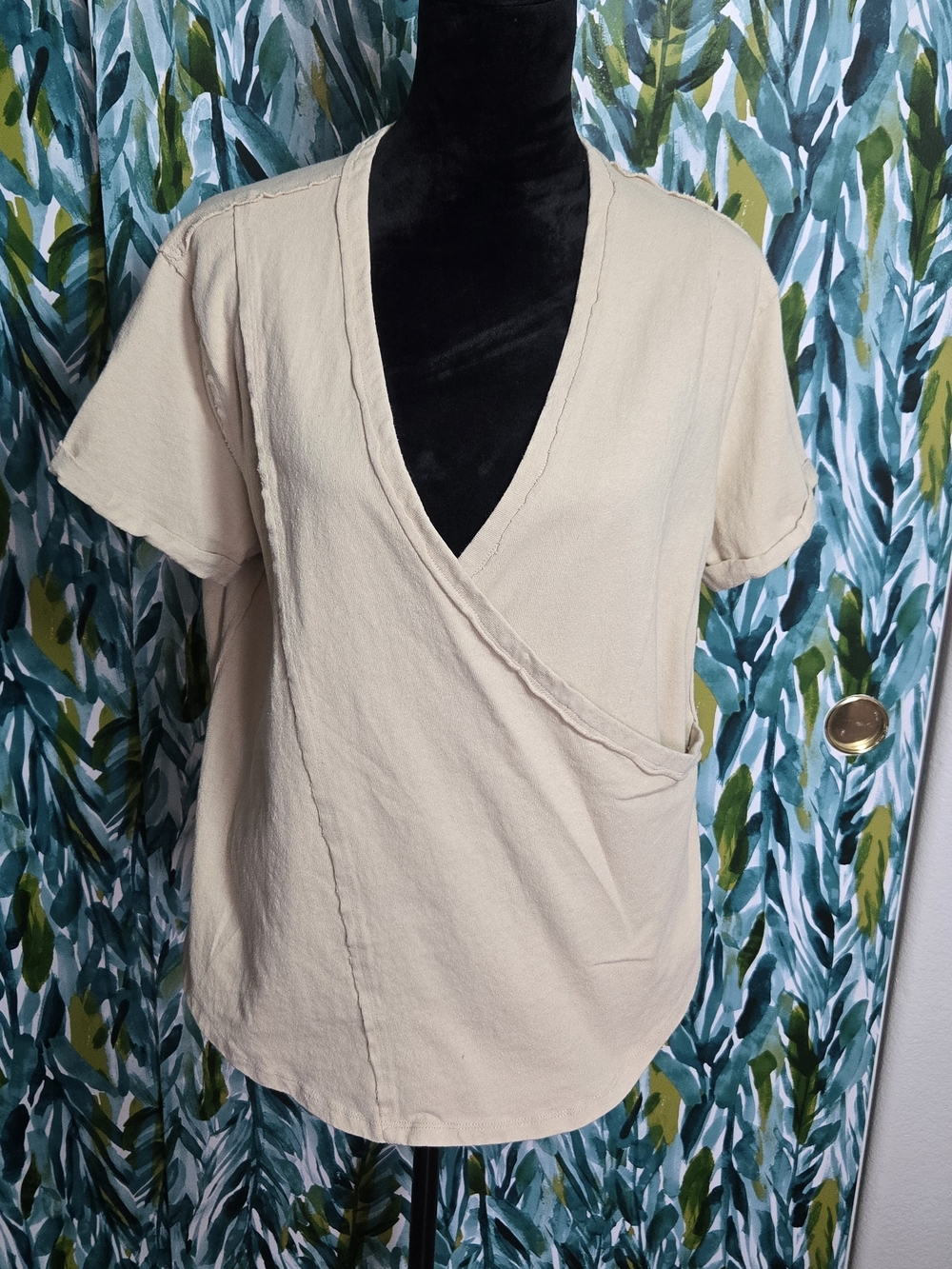 Aemi + Co Short Sleeve Faux Wrap Top in the shade "Natural"